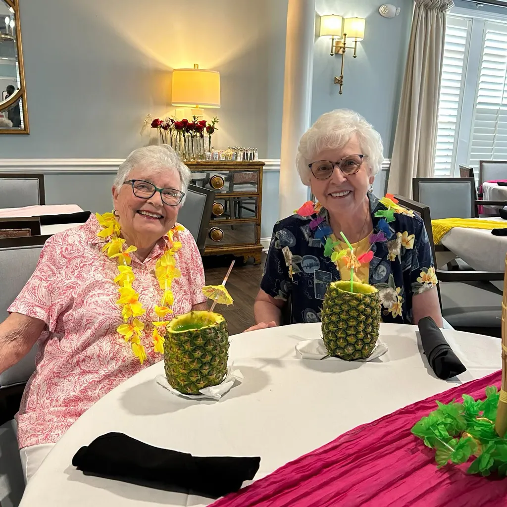 Two member with pineapple drinks